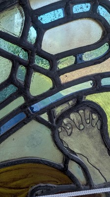 Lot 500 - A Pre-Raphaelite oval stained-glass window panel