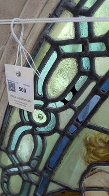 Lot 500 - A Pre-Raphaelite oval stained-glass window panel