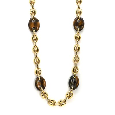 Lot 244 - An 18ct gold and carved tiger's eye necklace