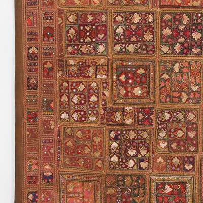 Lot 146 - A large patchwork and embroidered wall hanging