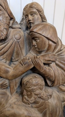 Lot 165 - A large carved walnut relief