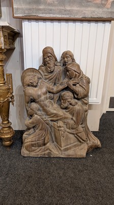 Lot 165 - A large carved walnut relief