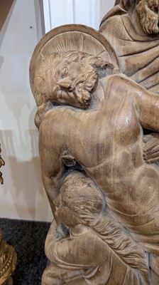 Lot 165 - A large carved walnut relief