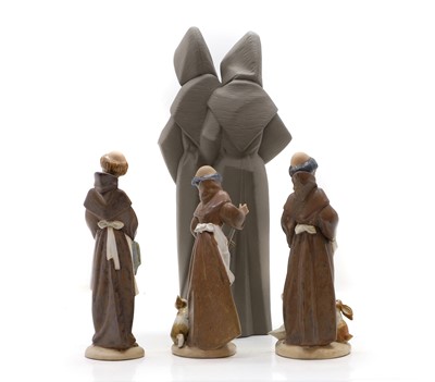 Lot 300 - A Lladro figure group of two monks