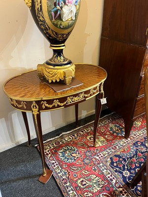 Lot 43 - A pair of Louis XVI-style kingwood and mahogany occasional tables