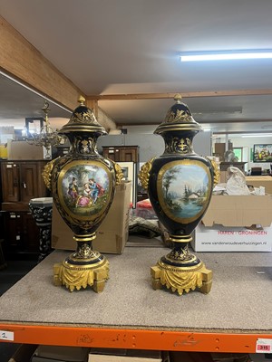 Lot 391 - A pair of large Sèvres-style porcelain vases and covers