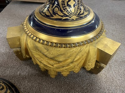 Lot 391 - A pair of large Sèvres-style porcelain vases and covers
