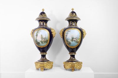 Lot 391 - A pair of large Sèvres-style porcelain vases and covers