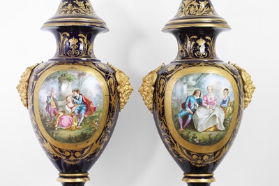 Lot 391 - A pair of large Sèvres-style porcelain vases and covers