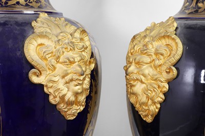 Lot 391 - A pair of large Sèvres-style porcelain vases and covers