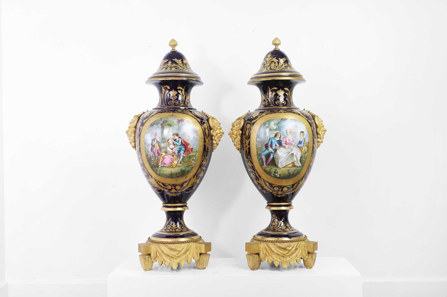 Lot 391 - A pair of large Sèvres-style porcelain vases and covers