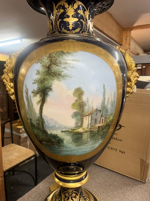 Lot 391 - A pair of large Sèvres-style porcelain vases and covers