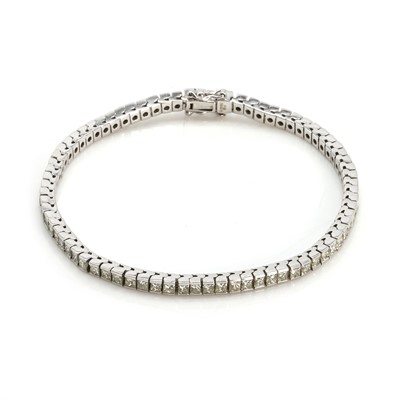 Lot 78 - An 18ct white gold diamond line bracelet