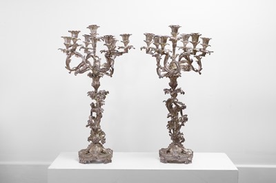 Lot 525 - A pair of large white metal seven-light candelabra