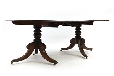 Lot 520 - A Regency-style mahogany twin pillar dining table