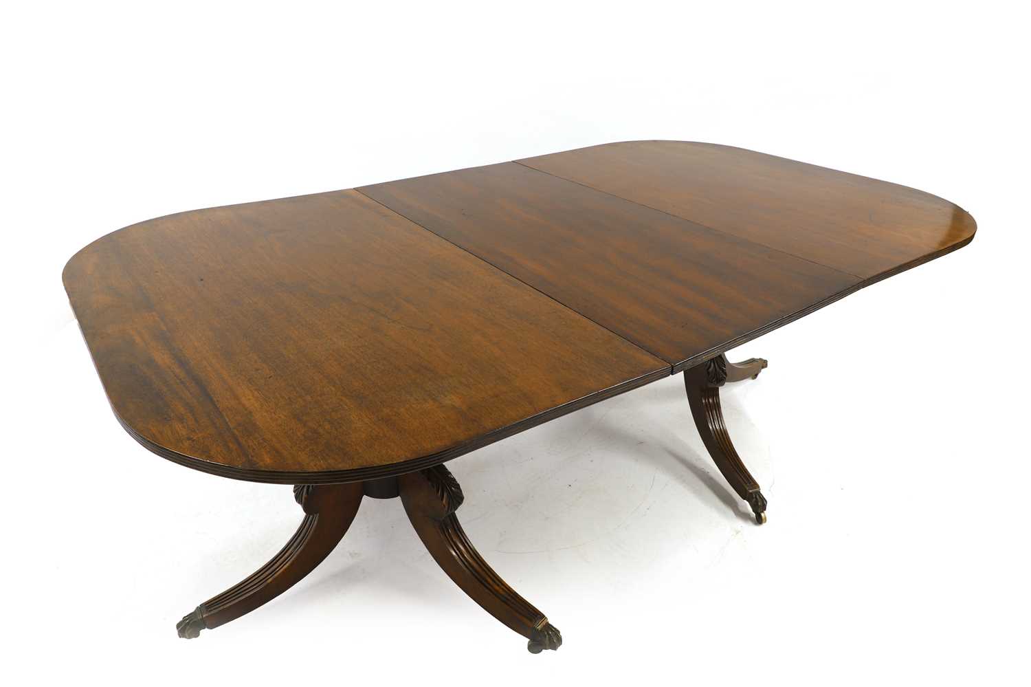 Lot 520 - A Regency-style mahogany twin pillar dining table