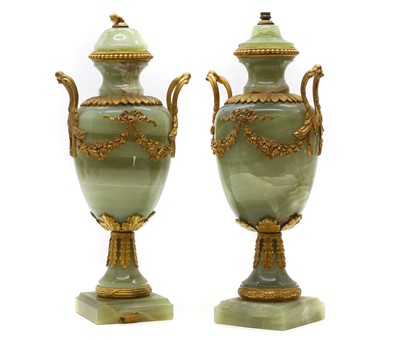 Lot 531 - A pair of gilt metal mounted onyx urn table lamps