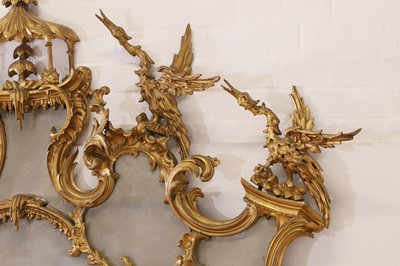 Lot 262 - A George III-style carved giltwood overmantel mirror