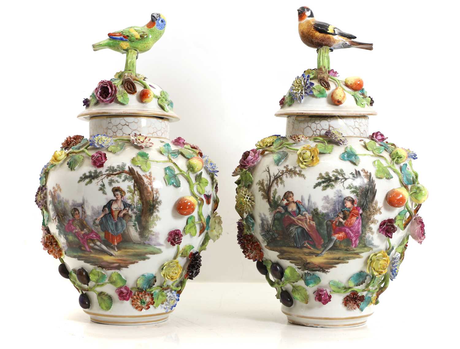 Lot 196 - A pair of Dresden type porcelain urns and covers