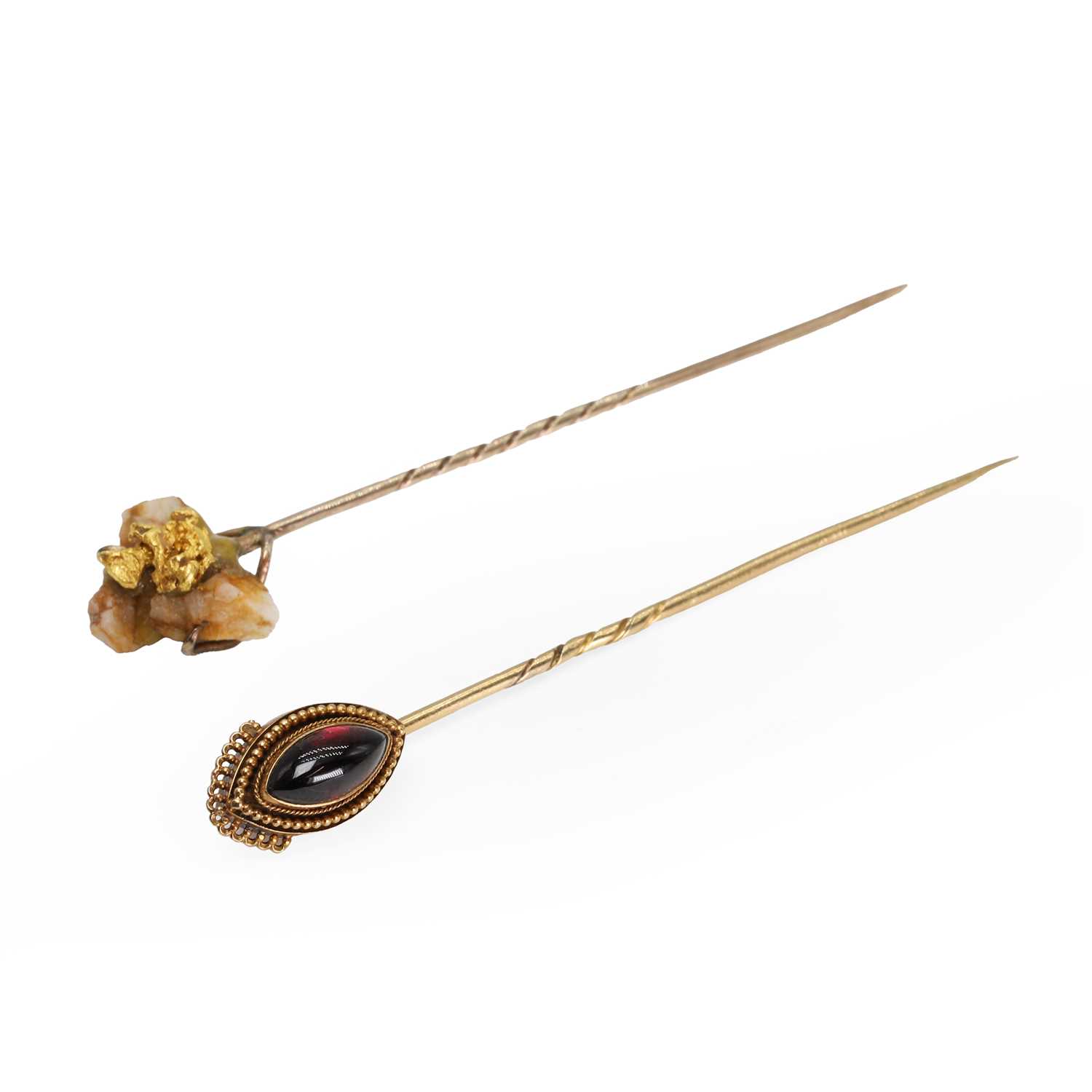 Lot 232 - A garnet stick pin and a gold nugget specimen stick pin