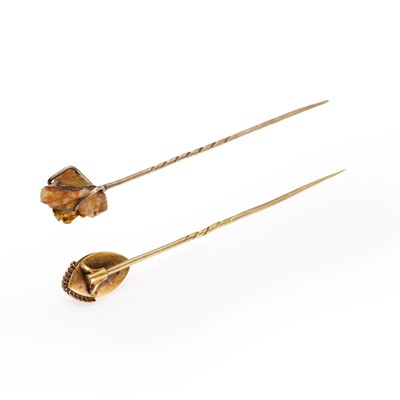 Lot 232 - A garnet stick pin and a gold nugget specimen stick pin
