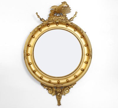 Lot 388 - A Regency-style giltwood convex mirror