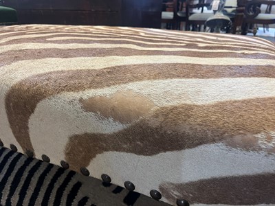 Lot 247 - A stained wood and zebra-skin stool