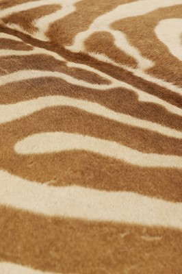 Lot 247 - A stained wood and zebra-skin stool