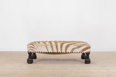 Lot 247 - A stained wood and zebra-skin stool