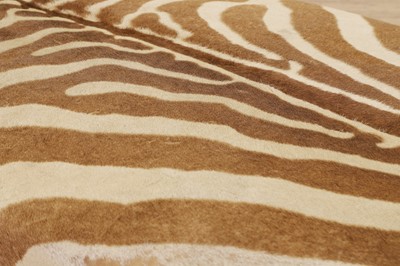 Lot 247 - A stained wood and zebra-skin stool