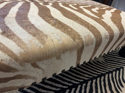 Lot 247 - A stained wood and zebra-skin stool