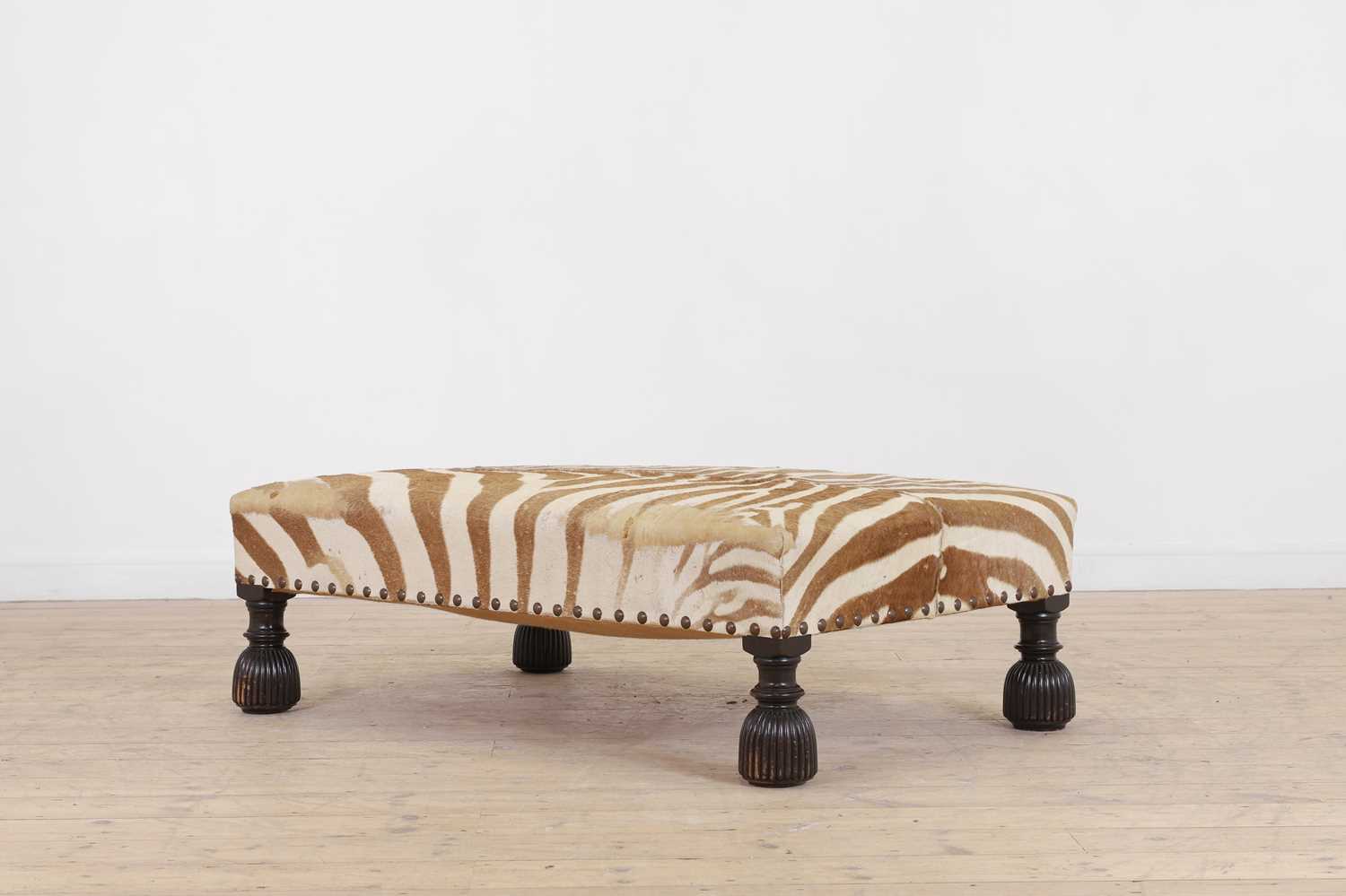 Lot 247 - A stained wood and zebra-skin stool