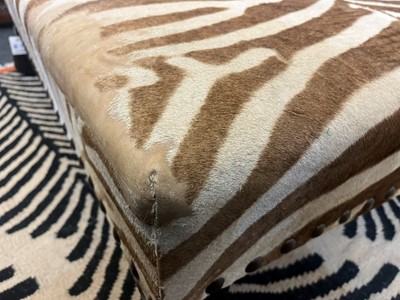 Lot 247 - A stained wood and zebra-skin stool