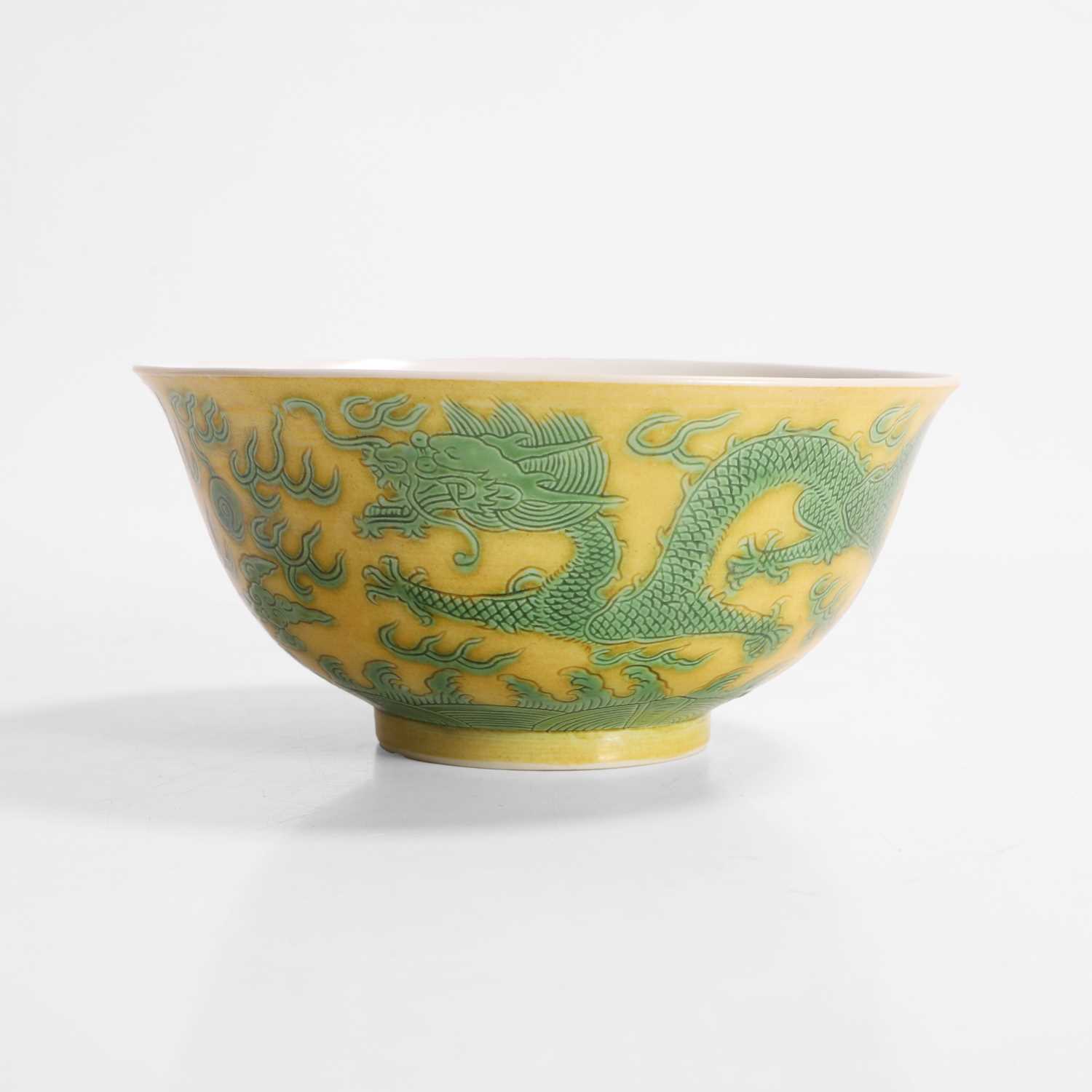 Lot 311 - A Chinese yellow ground and green-enamelled bowl