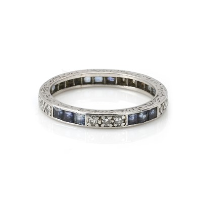 Lot 68 - An white gold sapphire and diamond eternity ring