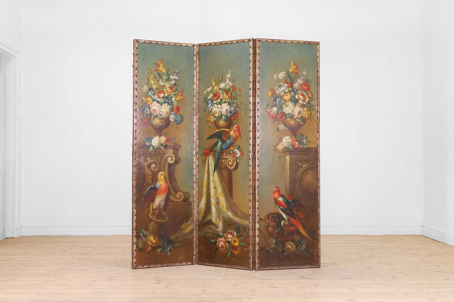 Lot 76 - A painted leather screen