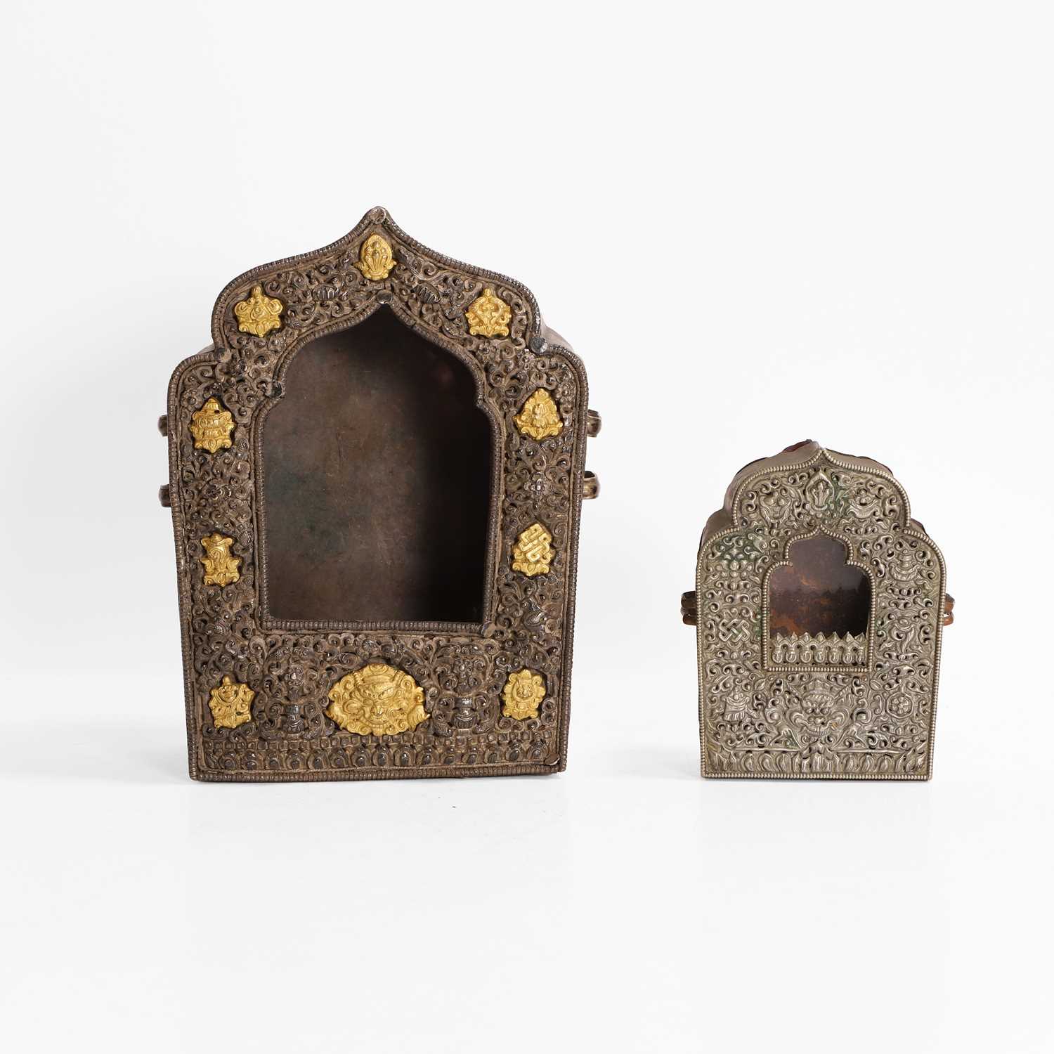 Lot 176 - Two Tibetan gilt, white-metal and copper travel shrines