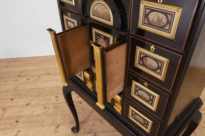 Lot 58 - A baroque ebonised fruitwood, pietra paesina, pietra dura and gilt-bronze-mounted cabinet on stand