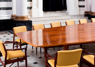 Lot 381 - A rosewood table and sixteen matching chairs