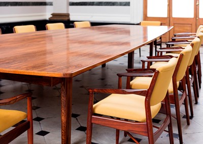 Lot A rosewood table and sixteen matching chairs
