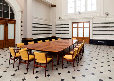 Lot 381 - A rosewood table and sixteen matching chairs