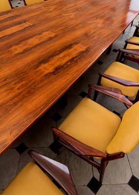 Lot 381 - A rosewood table and sixteen matching chairs