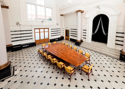 Lot 381 - A rosewood table and sixteen matching chairs