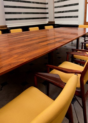 Lot 381 - A rosewood table and sixteen matching chairs