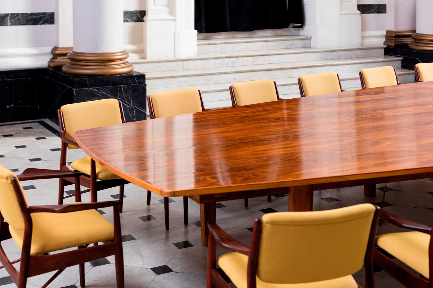 Lot 381 - A rosewood table and sixteen matching chairs