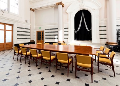 Lot 381 - A rosewood table and sixteen matching chairs