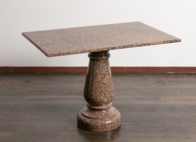 Lot 102 - A polished granite centre table