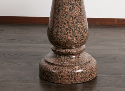 Lot 102 - A polished granite centre table