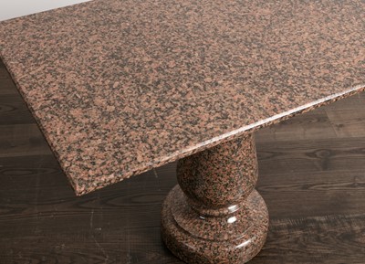 Lot 102 - A polished granite centre table