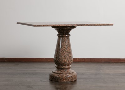 Lot 102 - A polished granite centre table